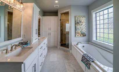 Glass Block Bathroom Window - Photo of a large glass block window above a tub in a beautiful modern bathroom. 