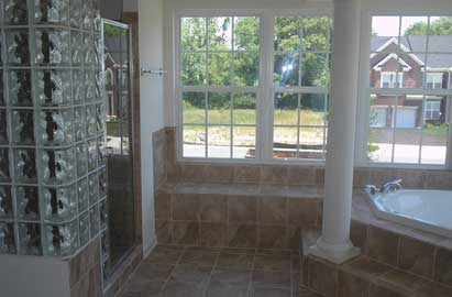 Glass Block Shower Walls - Photo of a beautiful round glass block shower wall in an upscale home. 