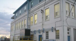 Commercial Glass Block Window Project - Photo of a commercial building that had all window replaced with gold color glass blocks.